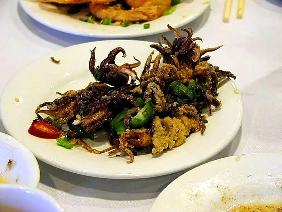 Plate of stir-fried squid with green peppers at a Chinese restaurant