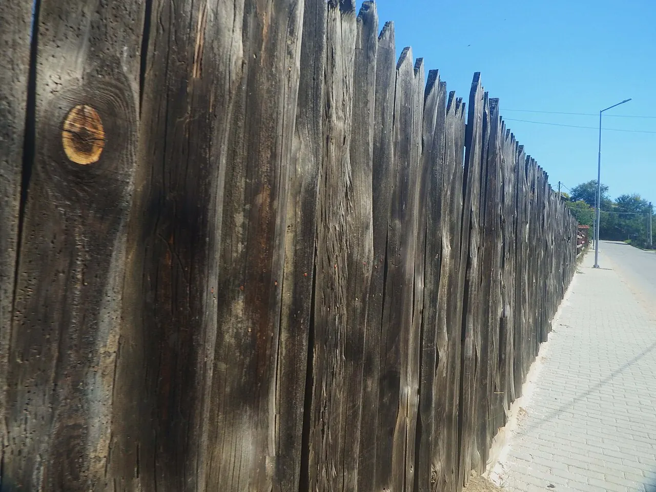 Close view of a wooden board fence