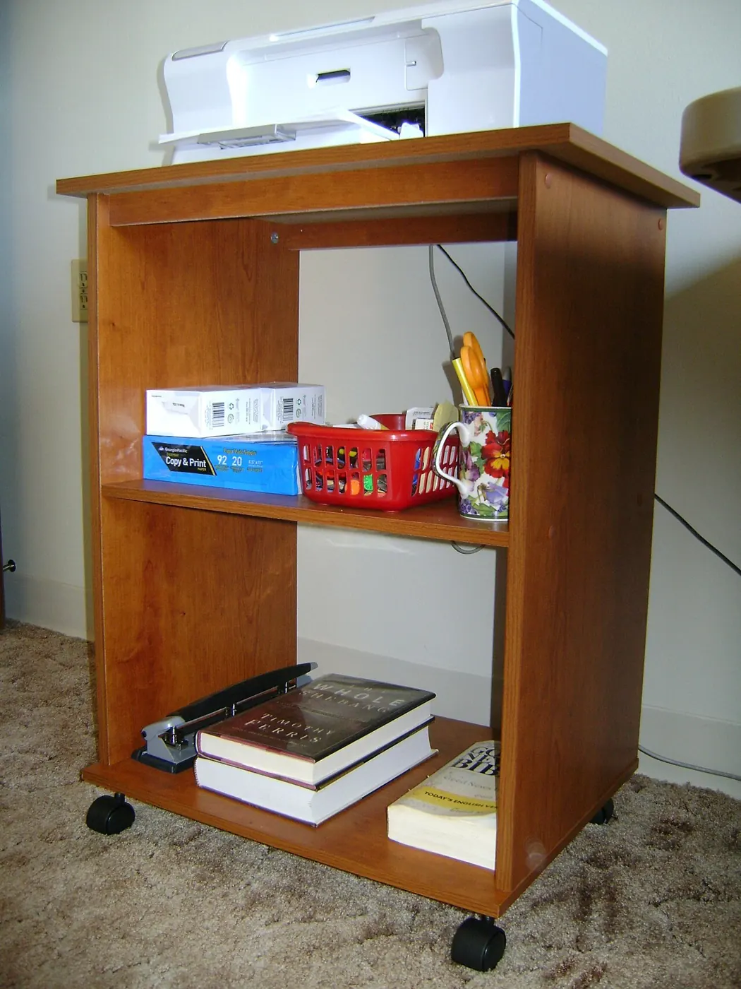 Assembled flat-pack printer stand with shelves