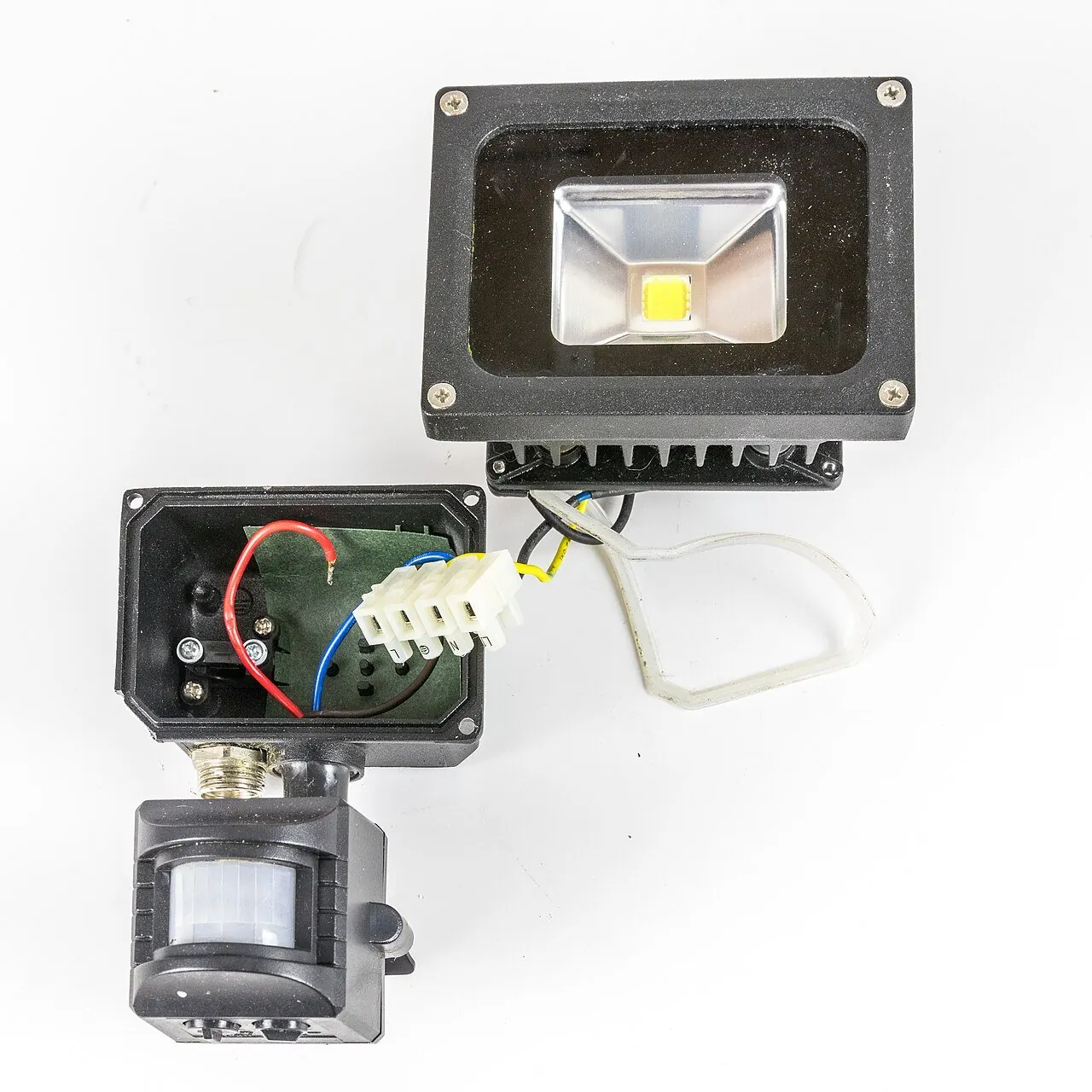 LED floodlight with a motion sensor underneath