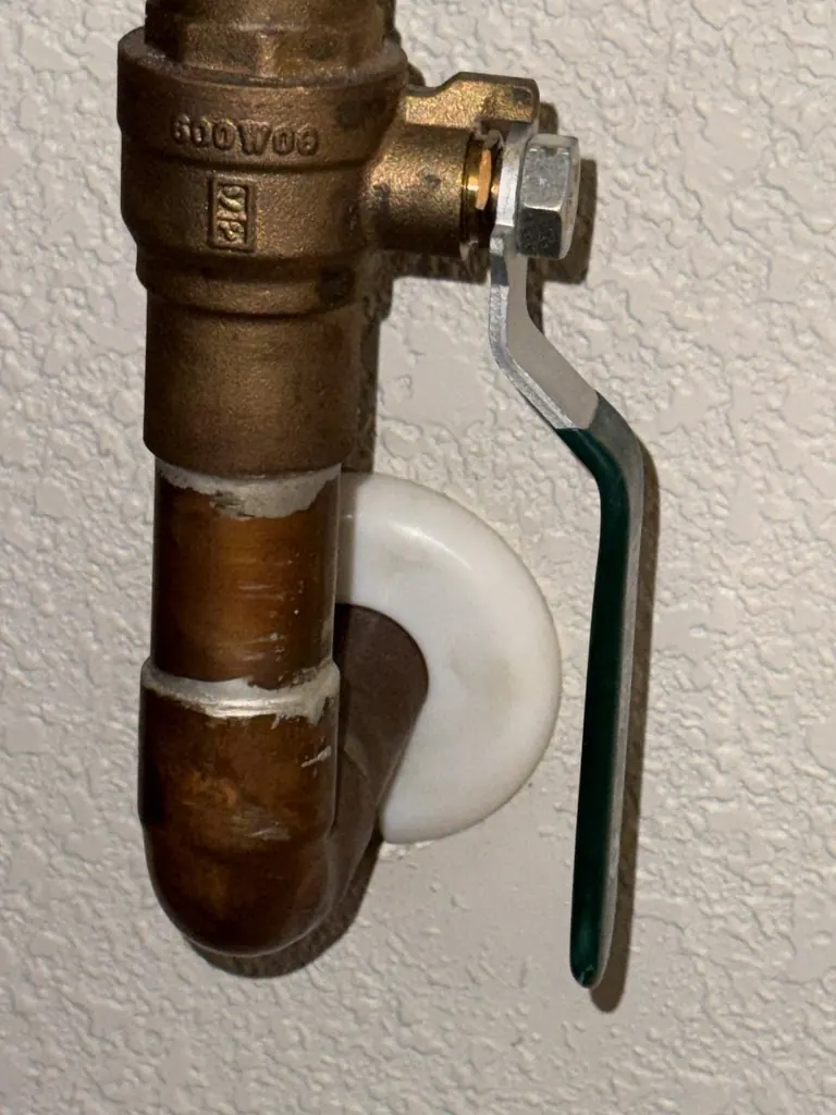 Brass shutoff valve on a copper water line