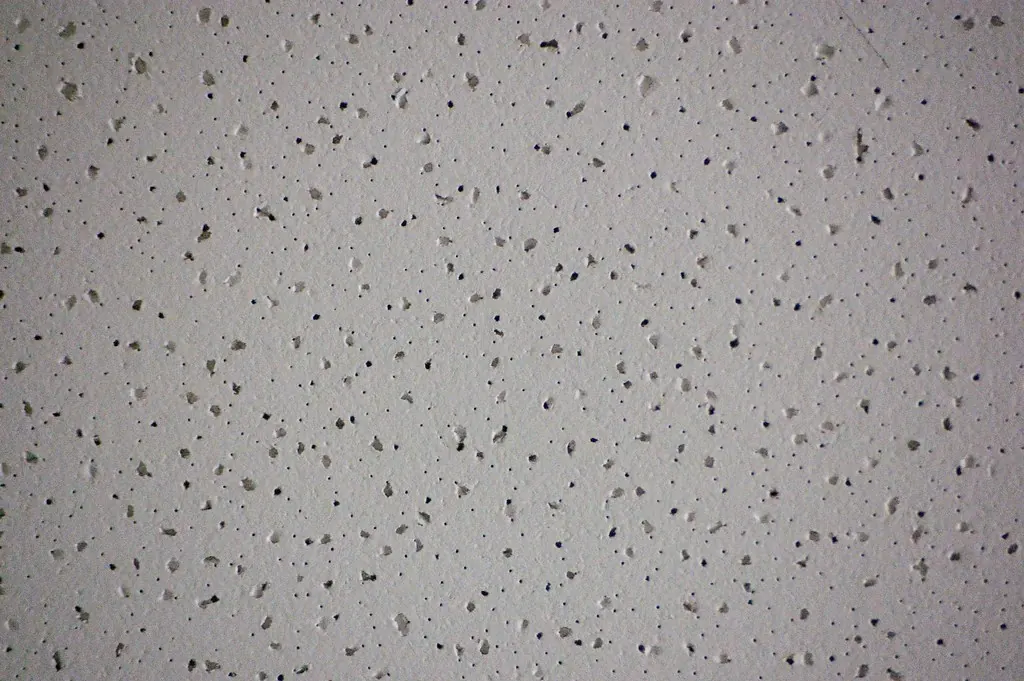 Close view of a textured acoustic ceiling surface