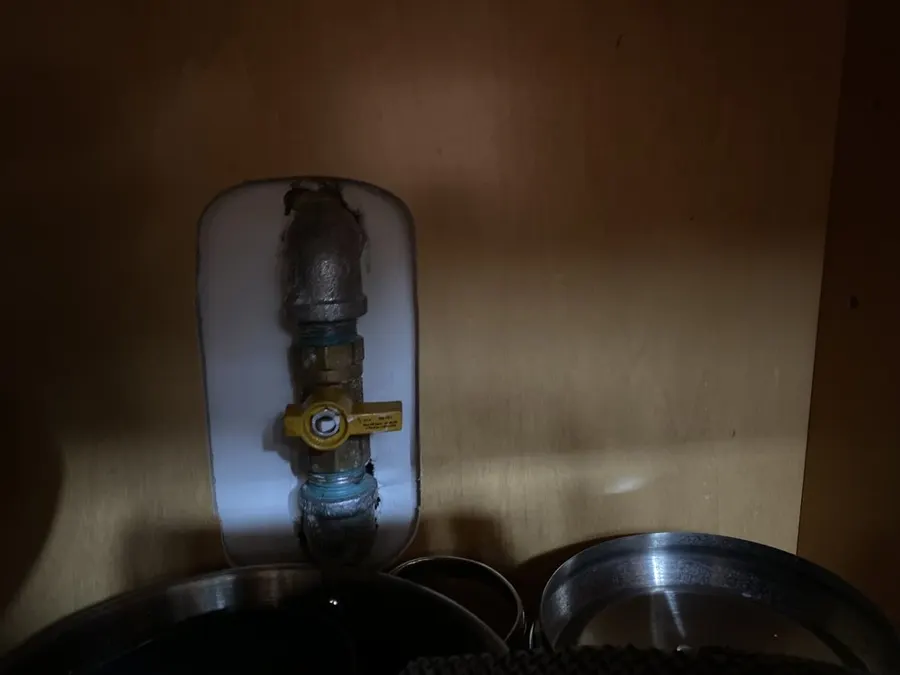 Under-sink supply line and angle stop connected to the wall