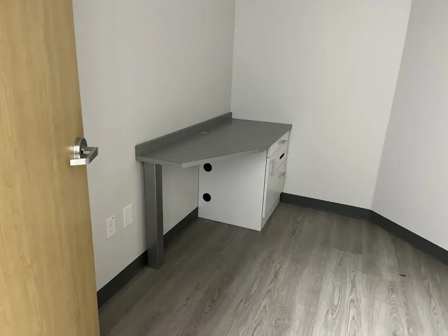 Small built-in desk with a drawer in a bright room